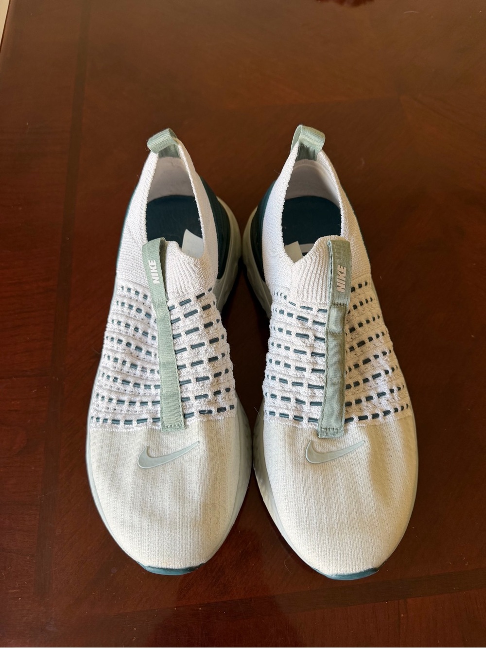 Nike Women’s Slip-On Knit Sneakers in Light Mint and White